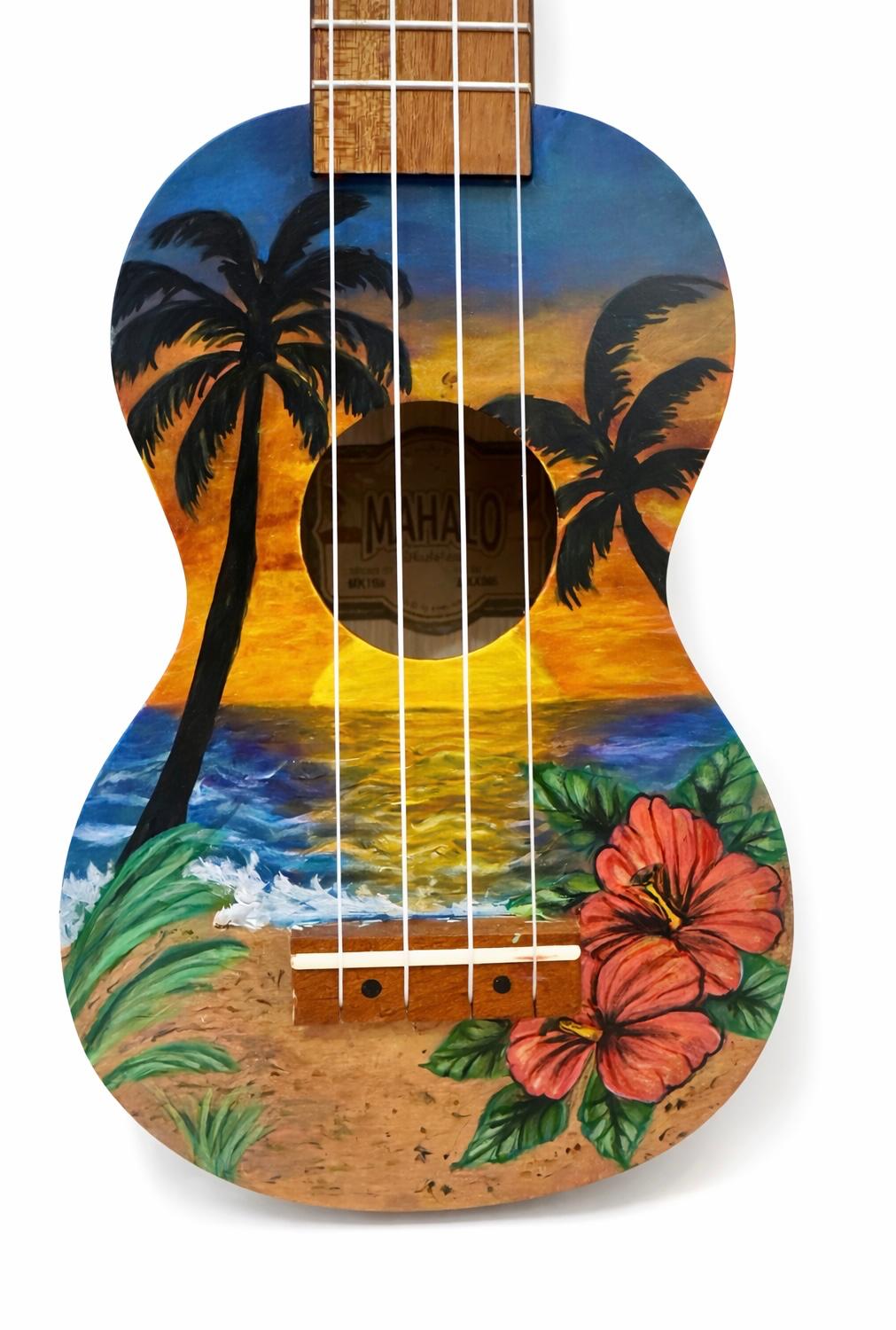 A ukulele painted with a beach scene featuring palm trees, a sunset, and a hibiscus flower.